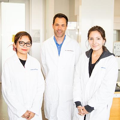 SOAR 2 Students and Faculty Member in Lab Coats